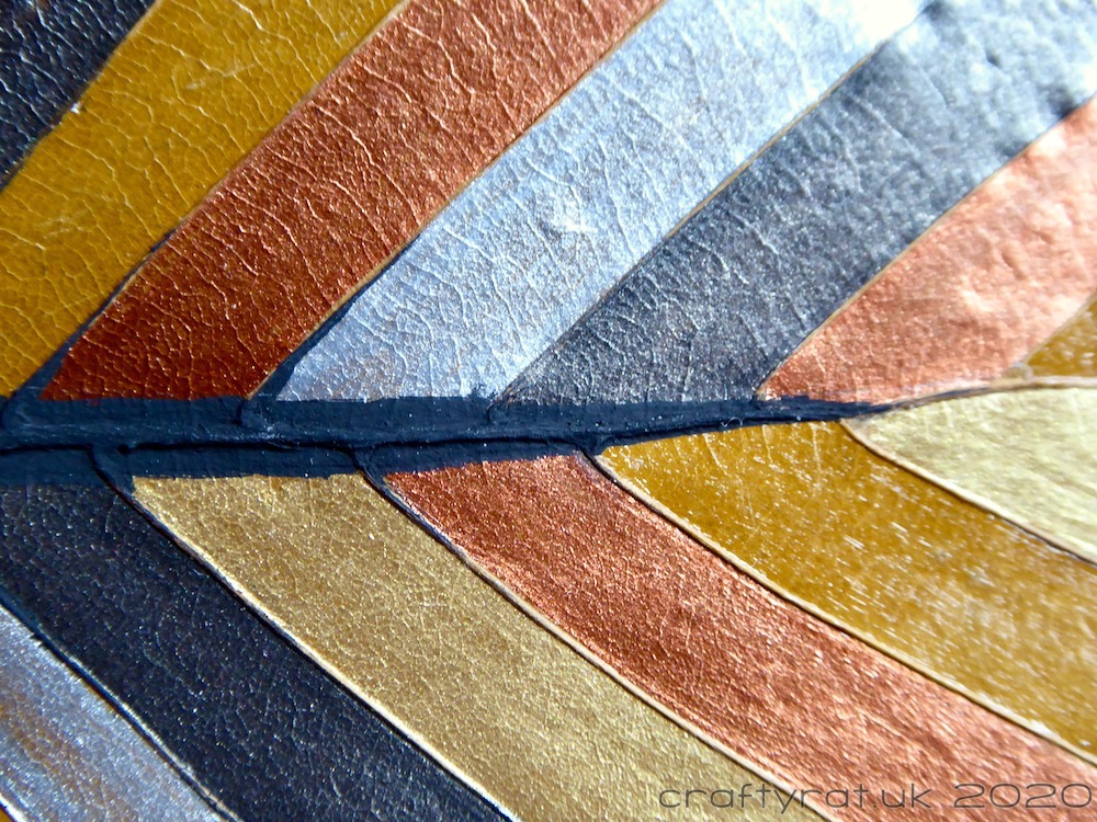 A close-up of the painted leaf.